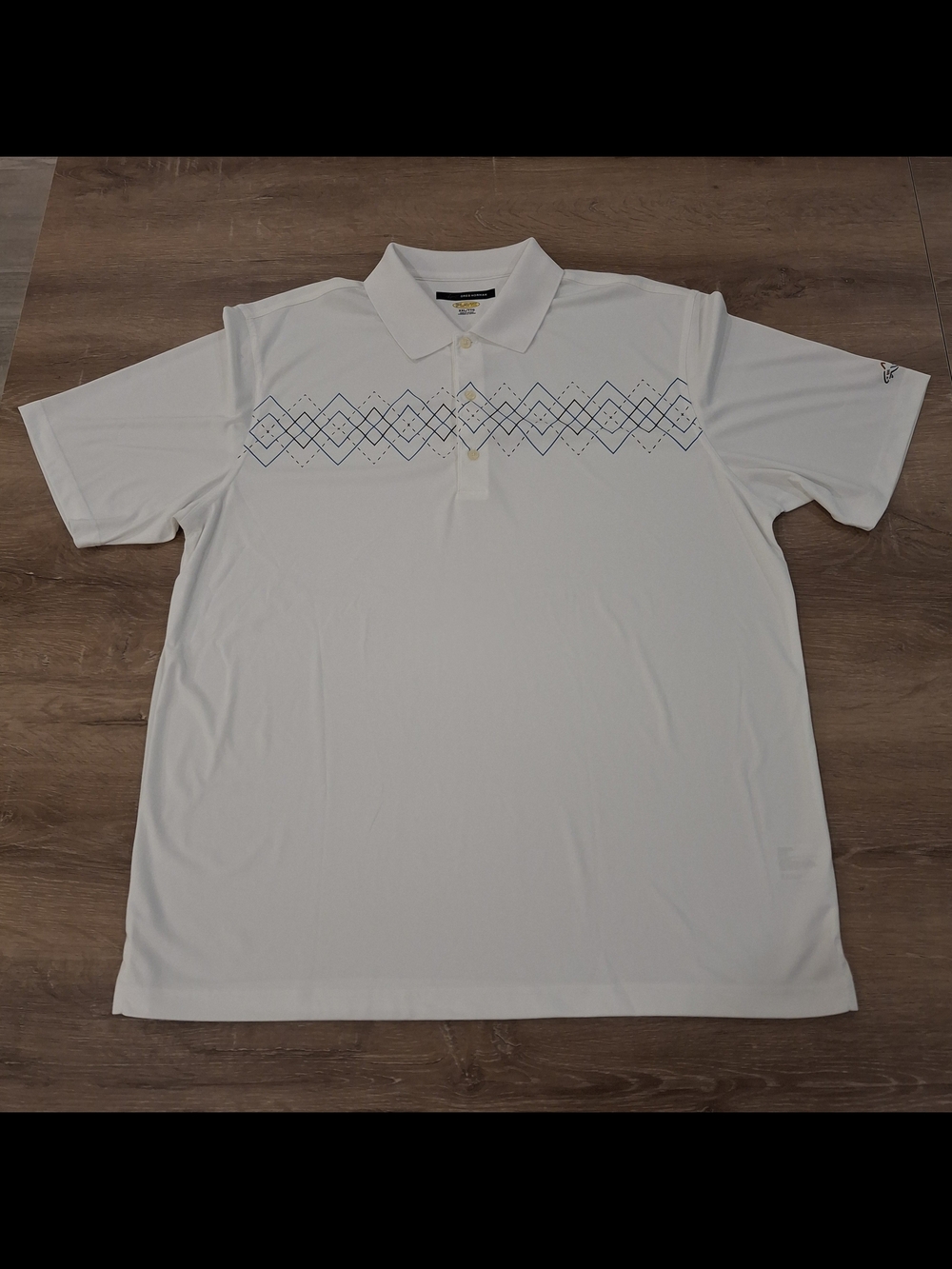 Greg Norman Collection White Polo with Navy Geometric Chest Pattern